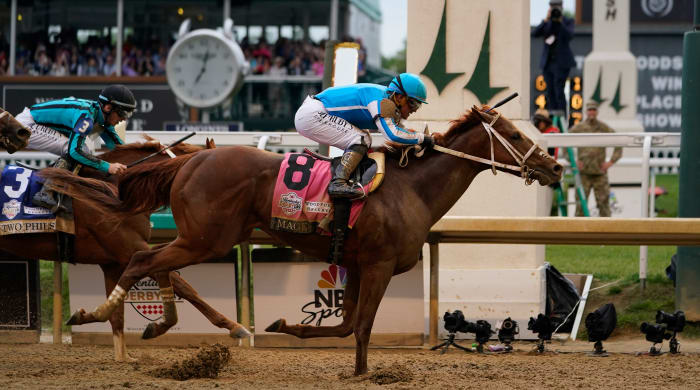 Mage with Javier Castellano cross the finish line at the 149th Kentucky Derby at Churchill Downs.
